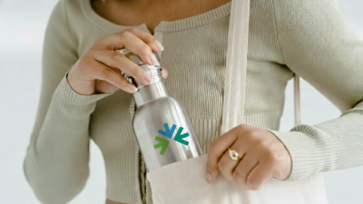 Women with branded aluminum water bottle 